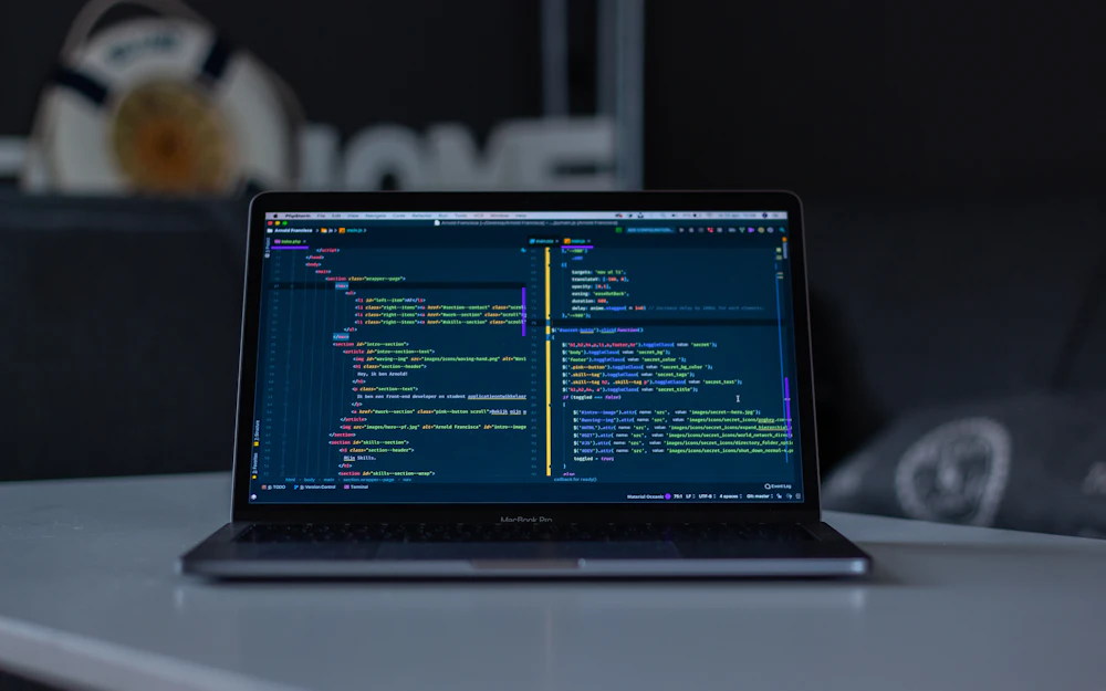 Developer laptop displaying code during preparation for a blockchain network upgrade