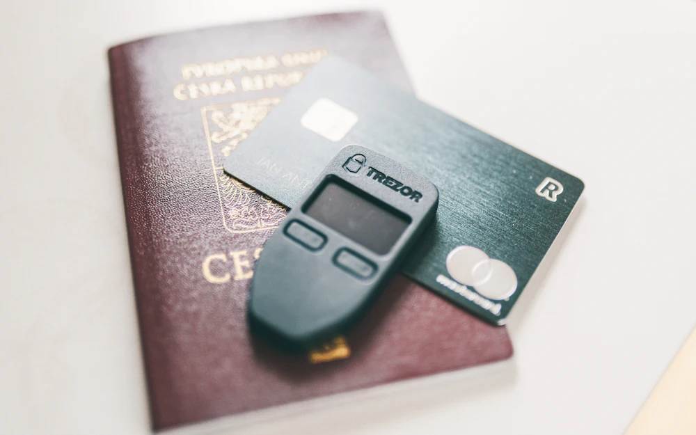 Hardware wallet on a desk representing withdrawal of crypto from a closing exchange